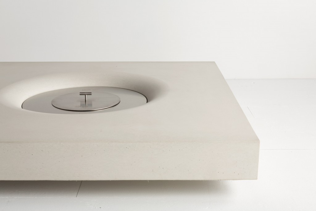 SERB round stainless steel manual ethanol burner installed in a square white island fire feature